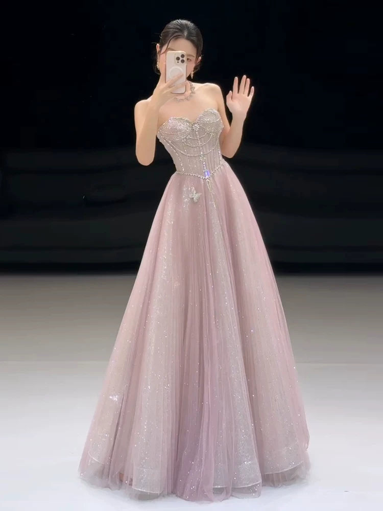 Funkelndes, trägerloses, pinkfarbenes Paillettenkleid in A-Linie – Inspiration für lange Partykleider und Abendkleider zum 20. Geburtstag AB2253