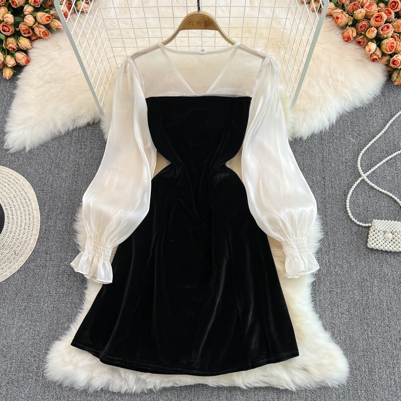 Robe noire à manches longues et col en V avec nœud et jolie robe tendance RF0211