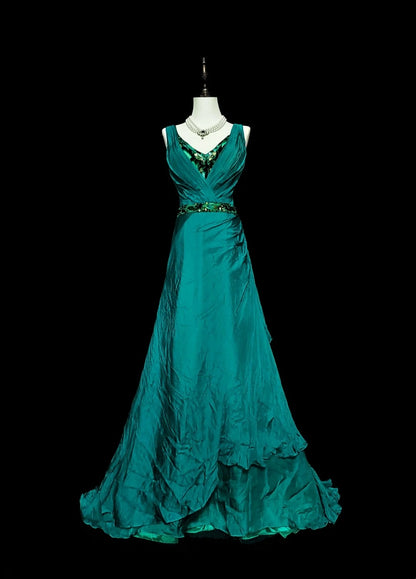 Robe de bal longue verte, coupe trapèze, col en V et corsage orné de perles, idéale pour les jeunes filles (N1296).