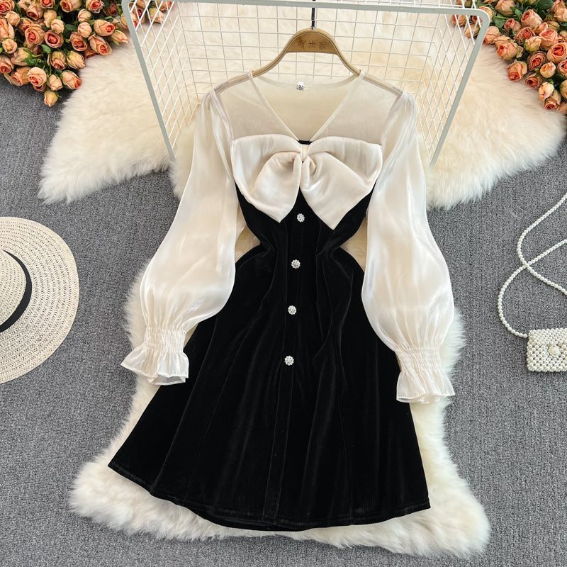 Robe noire à manches longues et col en V avec nœud et jolie robe tendance RF0211