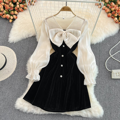 Robe noire à manches longues et col en V avec nœud et jolie robe tendance RF0211