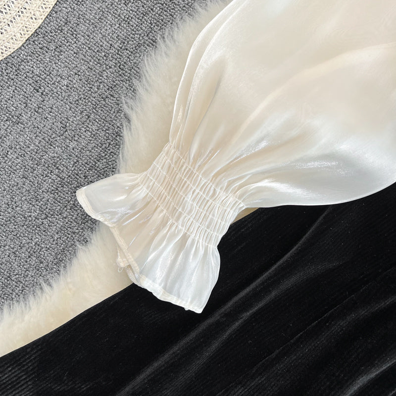 Robe noire à manches longues et col en V avec nœud et jolie robe tendance RF0211